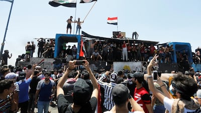 Demonstrators gesture as they take part in the ongoing anti-government protests after newly-appointed Iraqi Prime Minister Mustafa Kadhimi called for the release of all detained protesters, at Al Jumhuriya bridge in Baghdad, Iraq. REUTERS