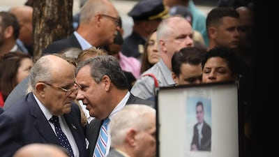 Rudy Giuliani, former New York City Mayor and attorney for President Donald Trump, left, and Chris Christie, former New Jersey governor, speak with each other during a commemoration ceremony for the victims of the September 11 terrorist attacks in New York City. AFP