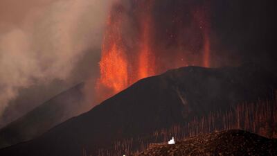 The Cumbre Vieja volcano spews lava, ash and smoke as seen from Los Llanos de Aridane on the Canary island of La Palma. AFP