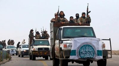 Al Qaeda-linked fighters driving their vehicles during a military drill in northern Syria. It took the Al Qaeda-linked militants only few days to capture more than two dozen towns and villages in and around Idlib province, cementing the group’s control over an area in northwestern Syria. AP