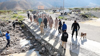Search and rescue teams look for the body of a man who went missing during a flash flood in the UAE. Courtesy RAK Police