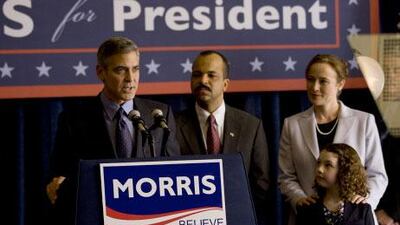 Governor Morris (George Clooney, left) addresses supporters after receiving Senator Thompson's (Jeffrey Wright, center) endorsement in The Ides of March.