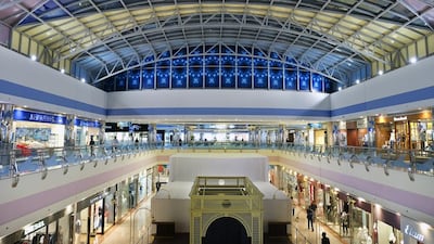 The mall has a canopied canvas roof at its centre that allows natural light to flood in, and that evokes a big top, with a central tower rising 128 metres into the sky. Delores Johnson / The National