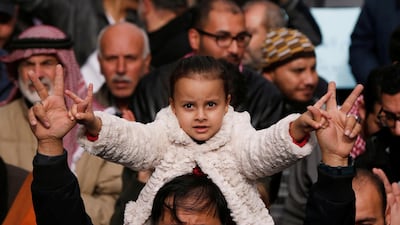 Demonstrators hold Jordanian national flag and chant slogans during a protest against a government's agreement to import natural gas from Israel, in Amman, Jordan. Reuters