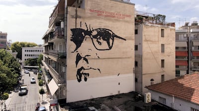 A giant mural depicts Italian composer Ennio Morricone created by Asterios Laskaris, Christos Laskaris and Dimitra Kalogirou under the auspices of the Greek Cultural Association Friends of Ennio Morricone's Music, in Larissa, Greece, July 24, 2018. Reuters