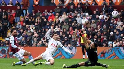 Tottenham Hotspur's Brennan Johnson scores their second goal past Aston Villa's Emiliano Martinez. Reuters