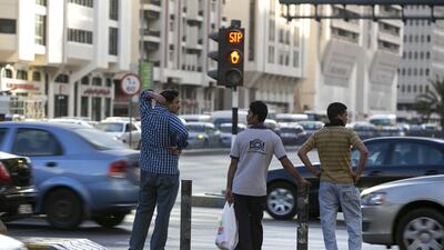 Countdown timers for vehicles, like those used at pedestrian crossings in Abu Dhabi, could improve traffic flow. Silvia Razgova / The National