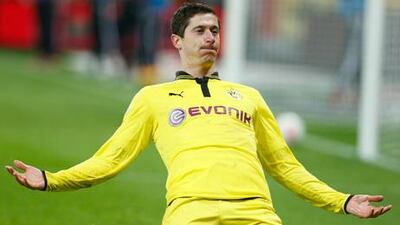 Borussia Dortmund striker Robert Lewandowski celebrates scoring against Bayer Leverkusen.