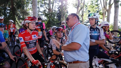 A UCI commissioner with race winner Jonas Vingegaard. EPA