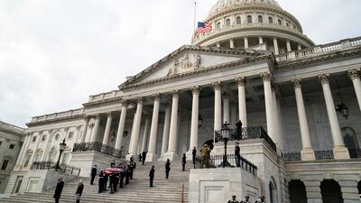 The casket of former senator Bob Dole of Kansas is led out of the US Capitol building before his funeral in Washington. Reuters