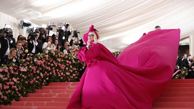 Lady Gaga certainly made an entrance as she arrived on the red carpet for the 2019 Met Gala on May 6, 2019. She wore a Brandon Maxwell dress that turned out to be four different looks, starting with this larger-than-life pink gown with a 25-foot cape. EPA