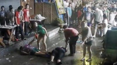 A still image taken from video released by the Hua Hin Municipality showing an elderly British couple and their son are on the ground after they were attacked while on holiday in Hua, Hin, Thailand. Hua Hin Municipality via AP Photo