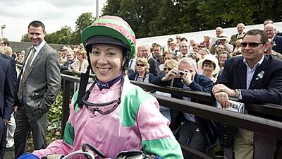Hayley Turner smiles after her victory.