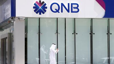 A man walks past a branch of Qatar National Bank (QNB) in Riyadh on June 5, 2017. Faisal Al Nasser / Reuters