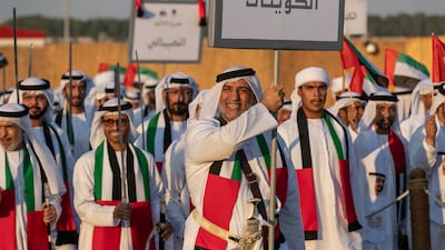An Emirati on the parade ground smiles as he carries the name of his tribe.