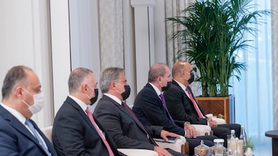 Members of King Abdullah's delegation during a meeting.