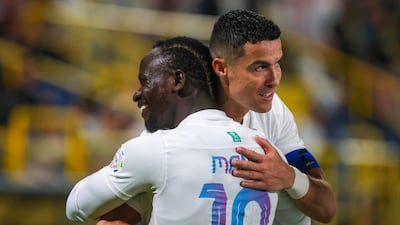 Cristiano Ronaldo, right, celebrates scoring with Sadio Mane during the Saudi Pro League football match between Al Nassr and Al Riyadh. AFP