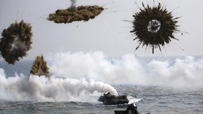 In this file photo, amphibious assault vehicles of the South Korean Marine Corps throw smoke bombs as they move to land on shore during a US-South Korea joint landing operation drill in Pohang March 30, 2015. Kim Hong-Ji / Reuters