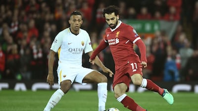 Liverpool's Egyptian midfielder Mohamed Salah, right, controls the ball during the UEFA Champions League first leg semi-final football match. AFP/Filippo MONTEFORTE