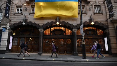 A Ukrainian flag hung from the facade of the London Coliseum ahead of the Dance for Ukraine special benefit gala. AFP