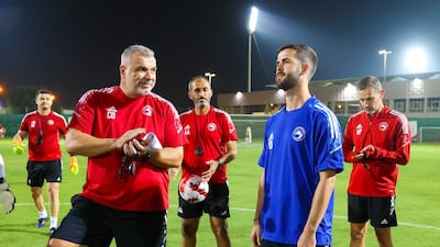 Miralem Pjanic talks to Sharjah manager Cosmin Olaroiu. Photo: Sharjah FC