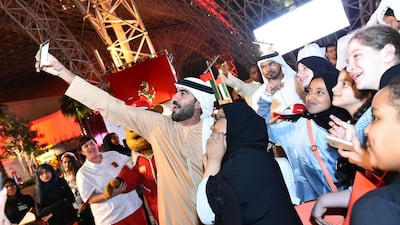Author, cultural consultant and television host Ali Al Saloom takes a selfie with fans at Ferrari World in Abu Dhabi. Courtesy Ferrari World