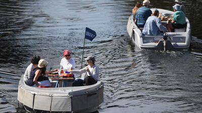 Groups of people enjoy boat trips in the sunshine on Regent's Canal, London. EPA
