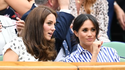 Catherine and Meghan attend the Wimbledon Lawn Tennis Championships in London in July 2018. Getty Images