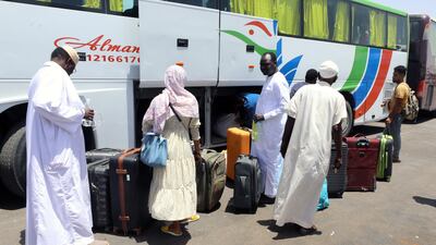 People fleeing Sudan arrive at Wadi Karkar bus station in Aswan, southern Egypt. EPA