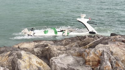 The vessel is partly submerged on the rocks near Mina Al Arab harbour. Courtesy: RAK Police