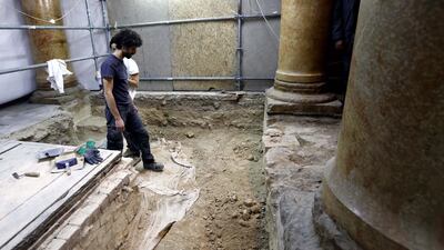 Members of an Italian restoration team work at the Church of Nativity, accepted by Christians as the birthplace of Jesus Christ, in the West Bank city of Bethlehem. The church, one of the world's oldest, is still undergoing massive reconstruction work, and is covered in white plastic sheets and scaffolding. EPA