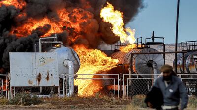A fire rages at Zarba oil plant in Al Qahtaniyah, Syria, which was hit by a series of Turkish air strikes. AFP