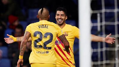Luis Suarez celebrates with fellow Barcelona goalscorer Arturo Vidal. EPA