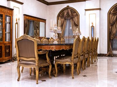 The copper-infused dining table was made by Basha Al Atrabi, who created furniture for King Farouk of Egypt. Photo: Victor Besa / The National