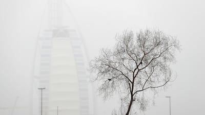 Burj Al Arab looks blurred from a distance as dust storms reduce visibility in Dubai. Chris Whiteoak / The National