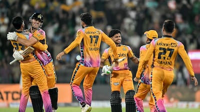 Peshawar Zalmi's players celebrate their PSL title win in the final against Hyderabad Kingsmen at the Qaddafi Stadium in Lahore. AFP
