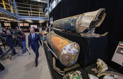 epa07197500 US Special Representative for Iran, Brian Hook (C), arrives for an 'Iranian Materiel Display' press conference in a hangar at Joint Base Anacostia-Bolling in Washington, DC, USA, 29 November 2018. Hook is walking past what are said to be recovered Iranian Qiam short range ballistic missiles. EPA/ERIK S. LESSER