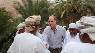Prince William is greeted by elders during a visit to Suwaih in Wadi al Arbeieen. Reuters