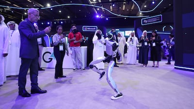 Humanoid Robot Unitree G1 does a dance for people in the AI section at Adipec 2025 at the Adnec in Abu Dhabi. Chris Whiteoak / The National