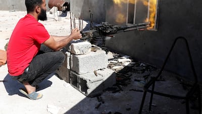 A fighter loyal to Libyan internationally recognised government fires a heavy machine gun during clashes with forces loyal to Khalifa Haftar at outskirts of Tripoli. Reuters