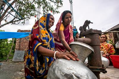 A water supply facility brings smiles to women in Bangladesh. Courtesy of Local Environment Development and Agricultural Research Society