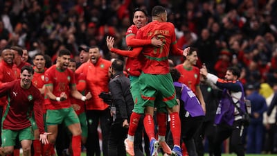 Morocco players celebrate victory over Nigeria. AFP