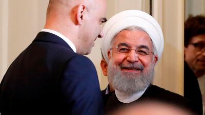 Tehran has called the arrests a 'false flag ploy' because of its timing as Iran president Hassan Rouhani, pictured with Swiss president Alain Berset, tours Europe. Ruben Sprich / AFP Photo