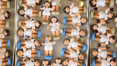 Hand-crafted wooden figurines of musical angels lie in a box after their assembly at the Frieder and Andre Uhlig Kunstgwerbe atelier. Sean Gallup / Getty Images