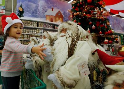 May Ray McCormick 3 years old with her father Daniel McCormick doing her last minute Christmas shopping at Yas Mall in Abu Dhabi. Ravindranath K / The National