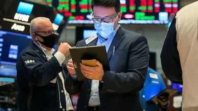 New York Stock Exchange, trader Americo Brunetti, center, works on the floor. With the Covid-19 vaccination supply crunch story taking a back seat, investors are finding a sense of optimism around the improving global economic outlook story. AP