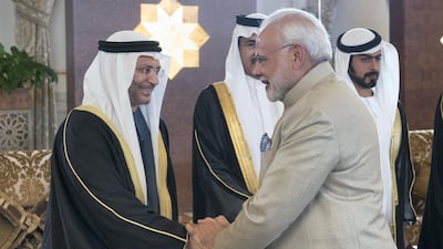 ABU DHABI, UNITED ARAB EMIRATES - February 10, 2018: HE Dr Anwar bin Mohamed Gargash, UAE Minister of State for Foreign Affairs (L), receives HE Narendra Modi Prime Minister of India (R), at the Presidential Airport. Seen with HH Sheikh Khalifa bin Tahnoon bin Mohamed Al Nahyan, Director of the Martyrs' Families' Affairs Office of the Abu Dhabi Crown Prince Court (back R) and HE Ahmed Juma Al Zaabi, UAE Deputy Minister of Presidential Affairs (back 2nd R). ( Rashed Al Mansoori / Crown Prince Court - Abu Dhabi ) ---