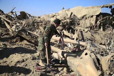 Afghan security official inspects the scene of a bomb blast that targeted Afghan National Army in Shirzad district of Nangarhar province, Afghanistan, 30 January 2021. EPA photo