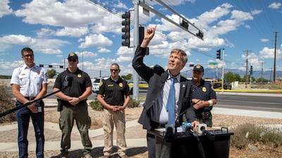 Albuquerque Mayor Tim Keller, accompanied by law enforcement officials, indicates the trajectory of the fatal balloon crash during a news conference in Albuquerque, New Mexico. AP Photo