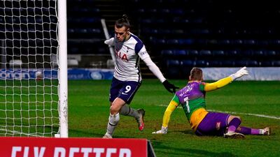 Tottenham Hotspur's Welsh striker Gareth Bale (R) celebrates after scoring their first goal. AFP
